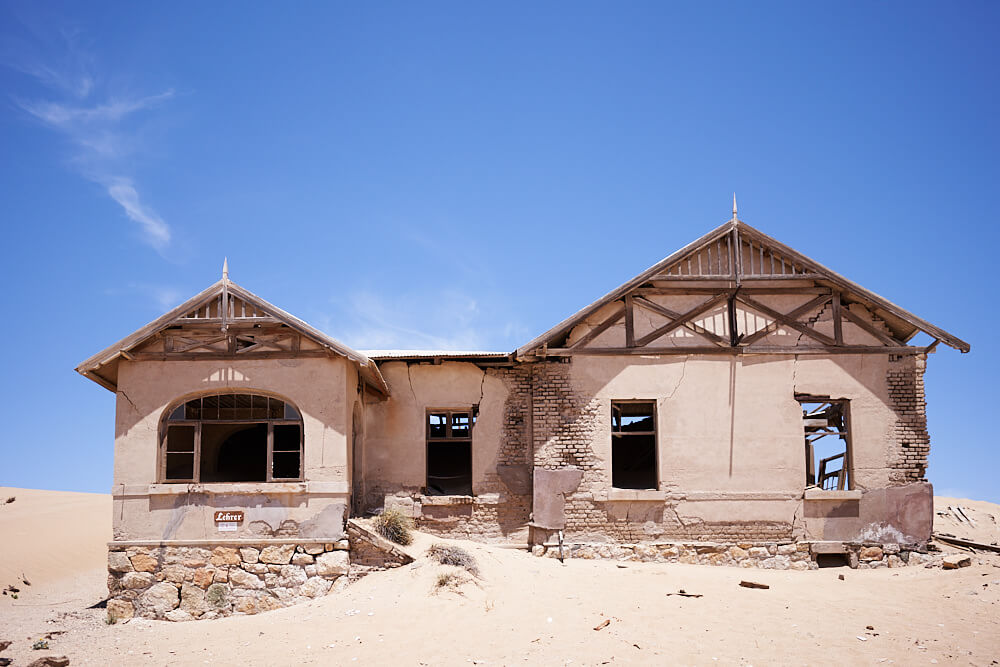 The picture shows one of the crumbling houses in Kolmanskop.