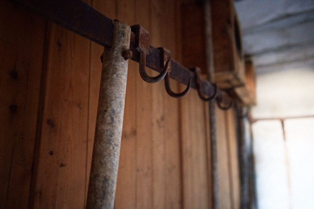 The picture shows rusted hooks, in the old slaughterhouse, in Kolmanskop