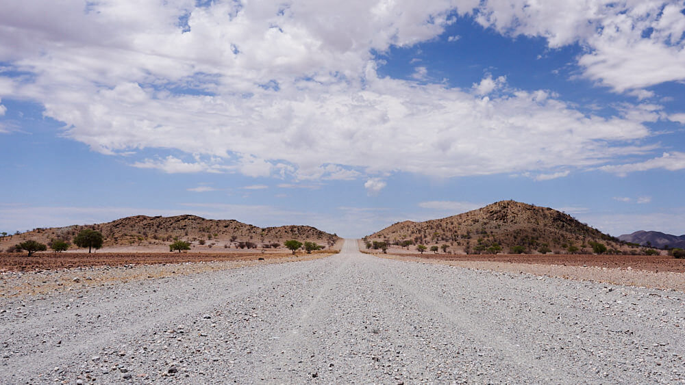 The picture shows a gravel road that seems to lead directly to the sky.